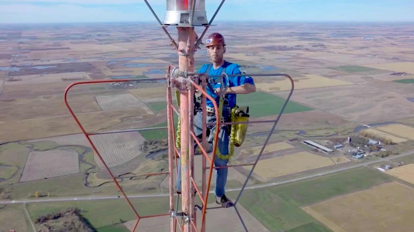 It is a drone video of a TV tower repairman who scales a 1,500-foot high television antenna. I guess, he must have nerves of steel because he looks more relaxed holding on to that antenna than I do holding on to my morning cup of coffee