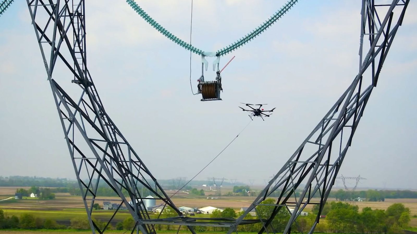This drone helps workers carry power lines between high towers [Demonstration video]